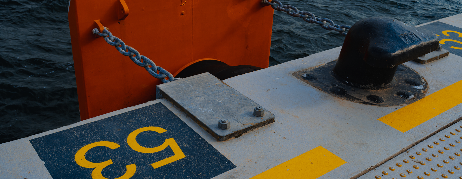concrete pier with yellow designations close up